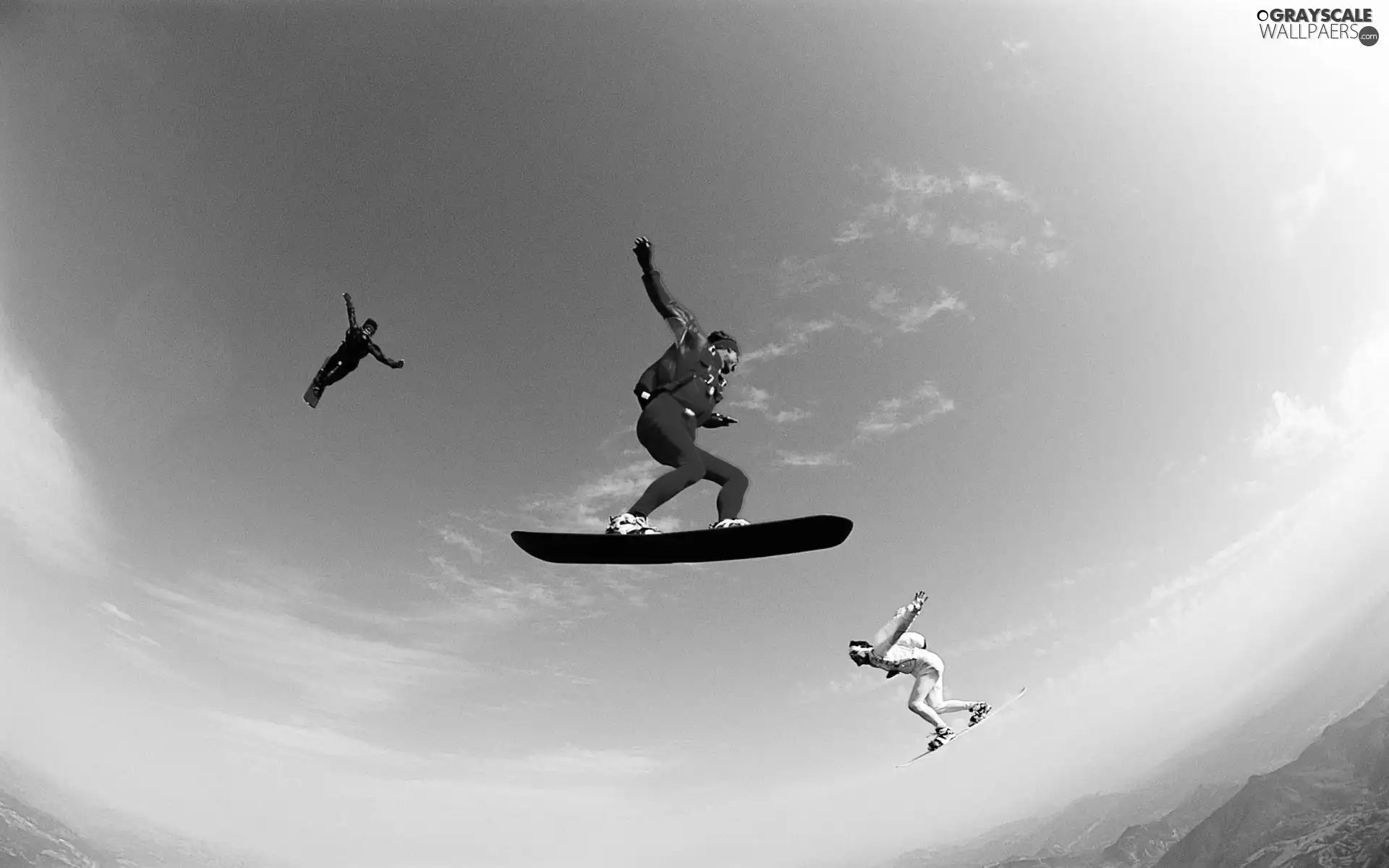 parachute, snowboarders, jumps