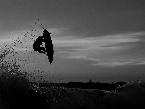 a man, Surfing, sun, sea, west