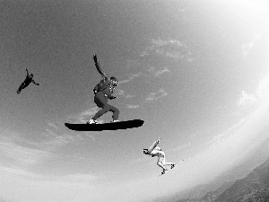 parachute, snowboarders, jumps
