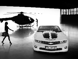 Women, a man, Camaro, Helicopter, Chevrolet