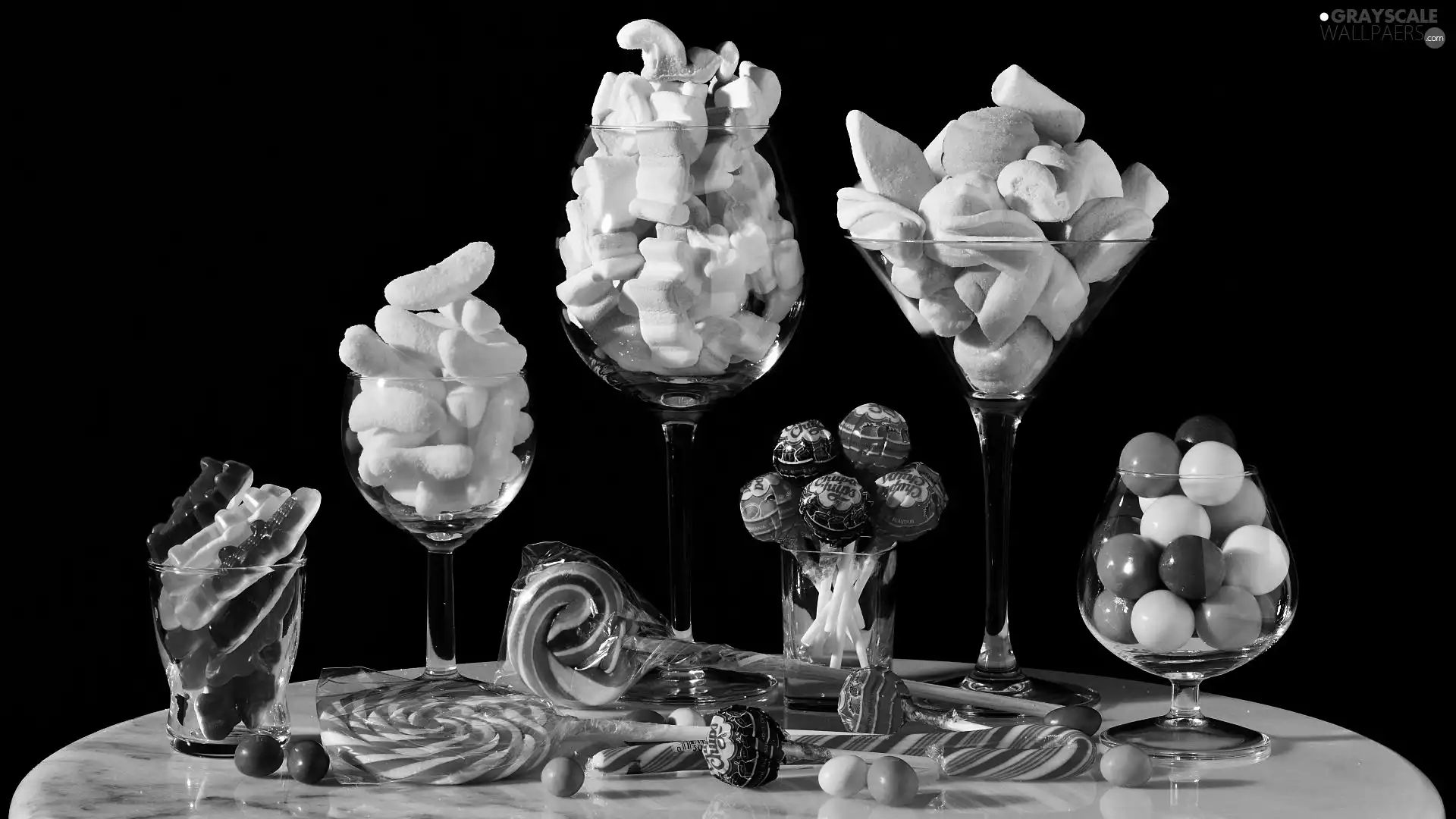 glasses, black background, lollipops, jellies, Candies