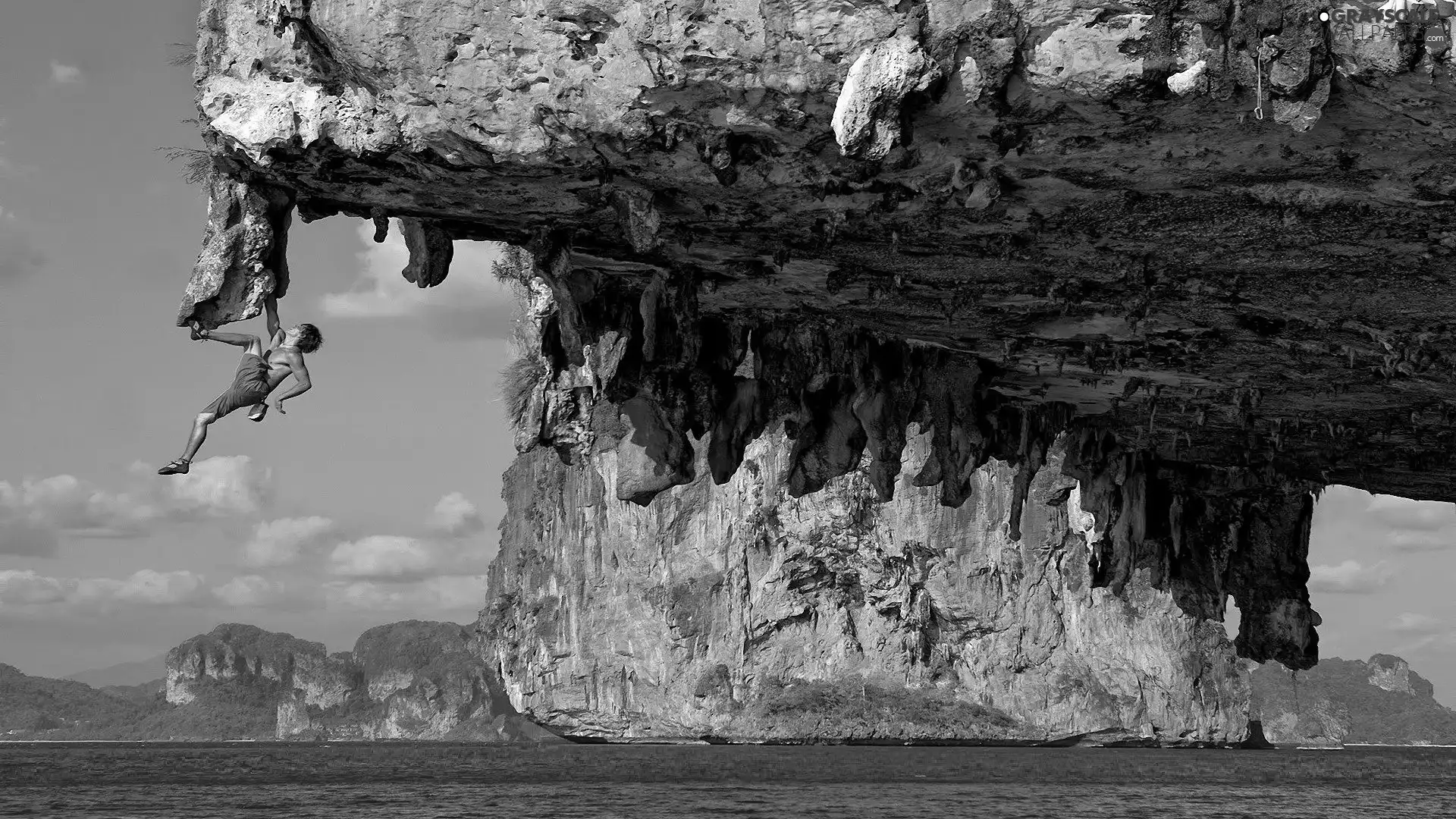 a man, sea, Rocks