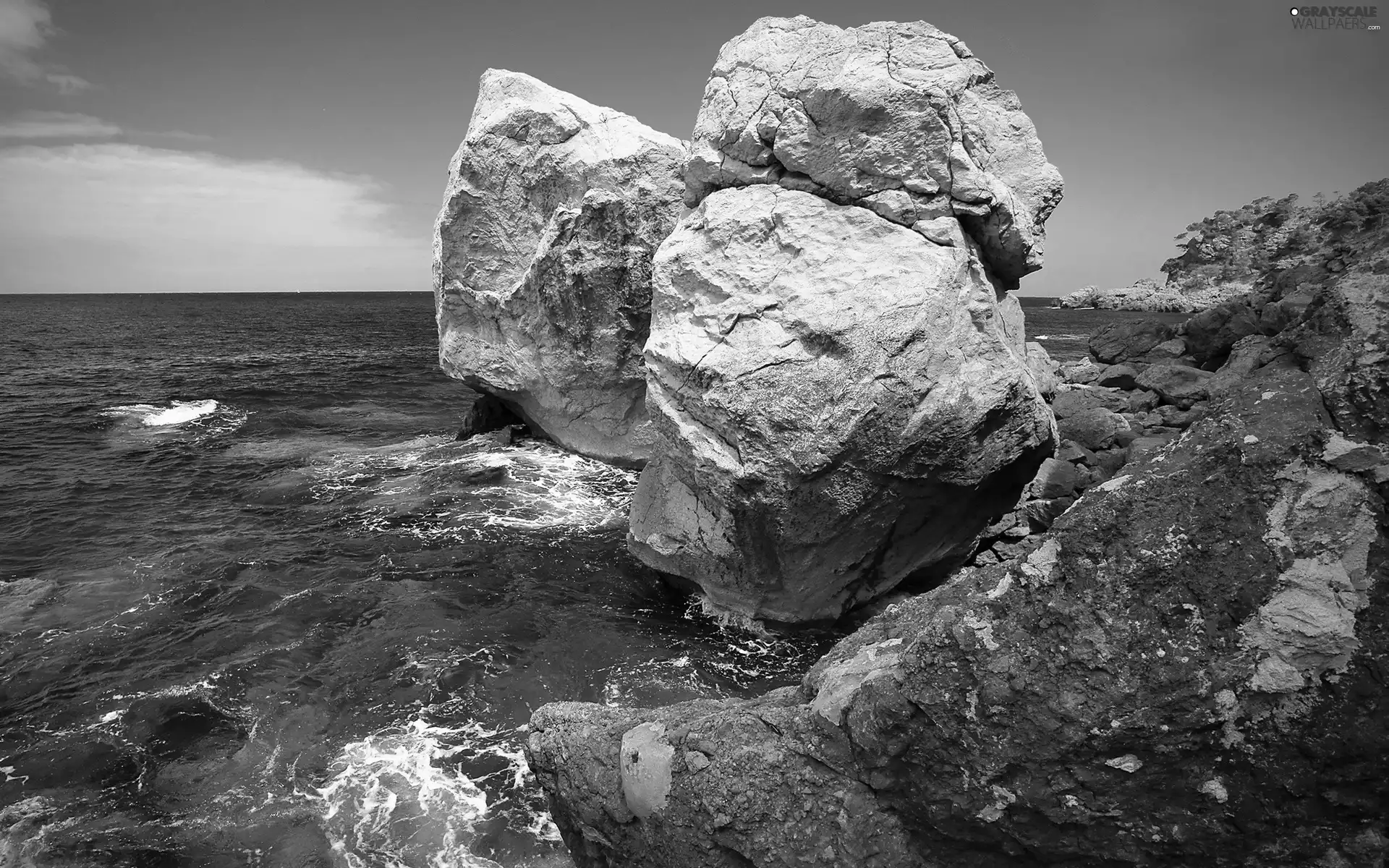 Sky, boulders, sea