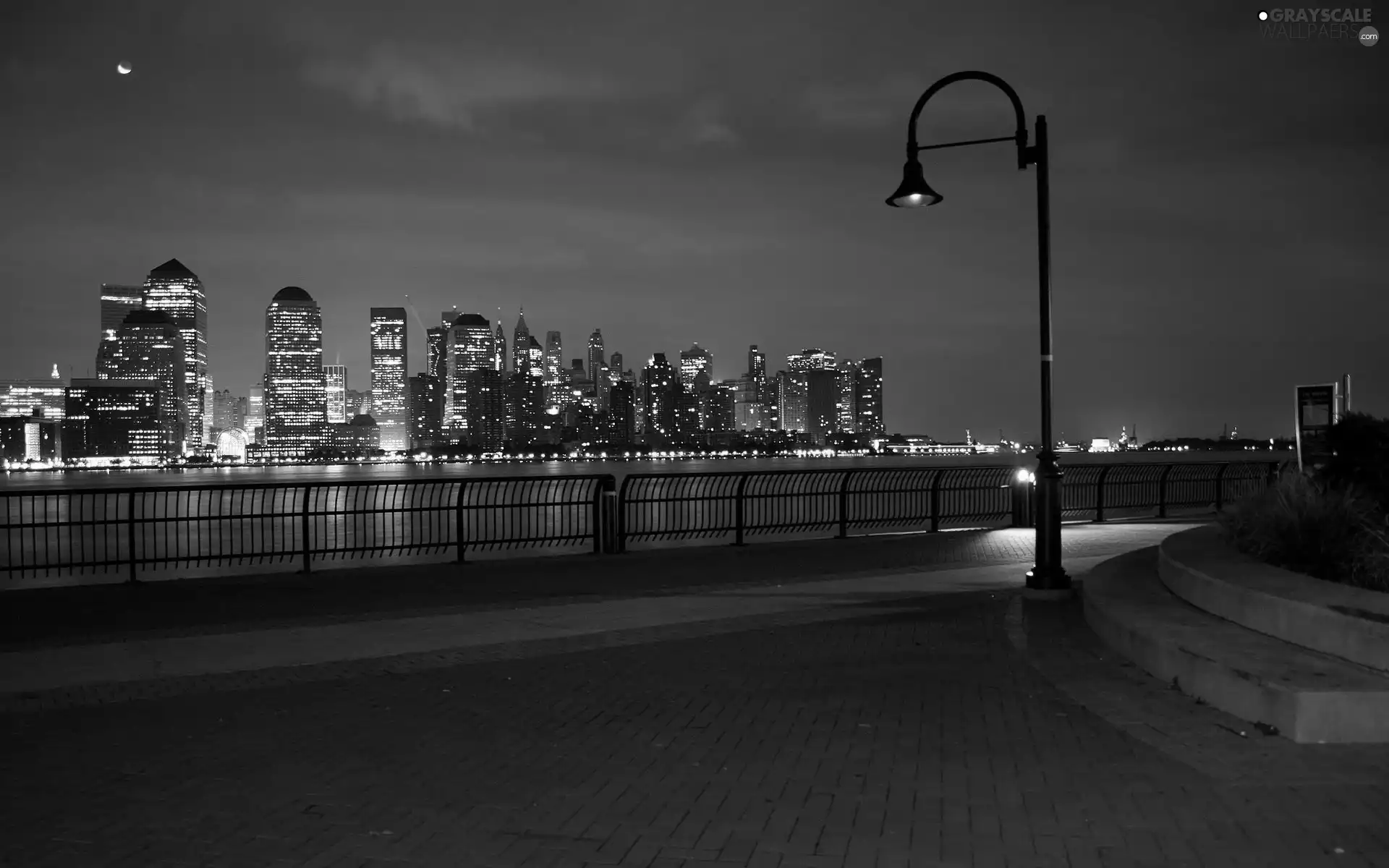 Lighthouse, skyscrapers