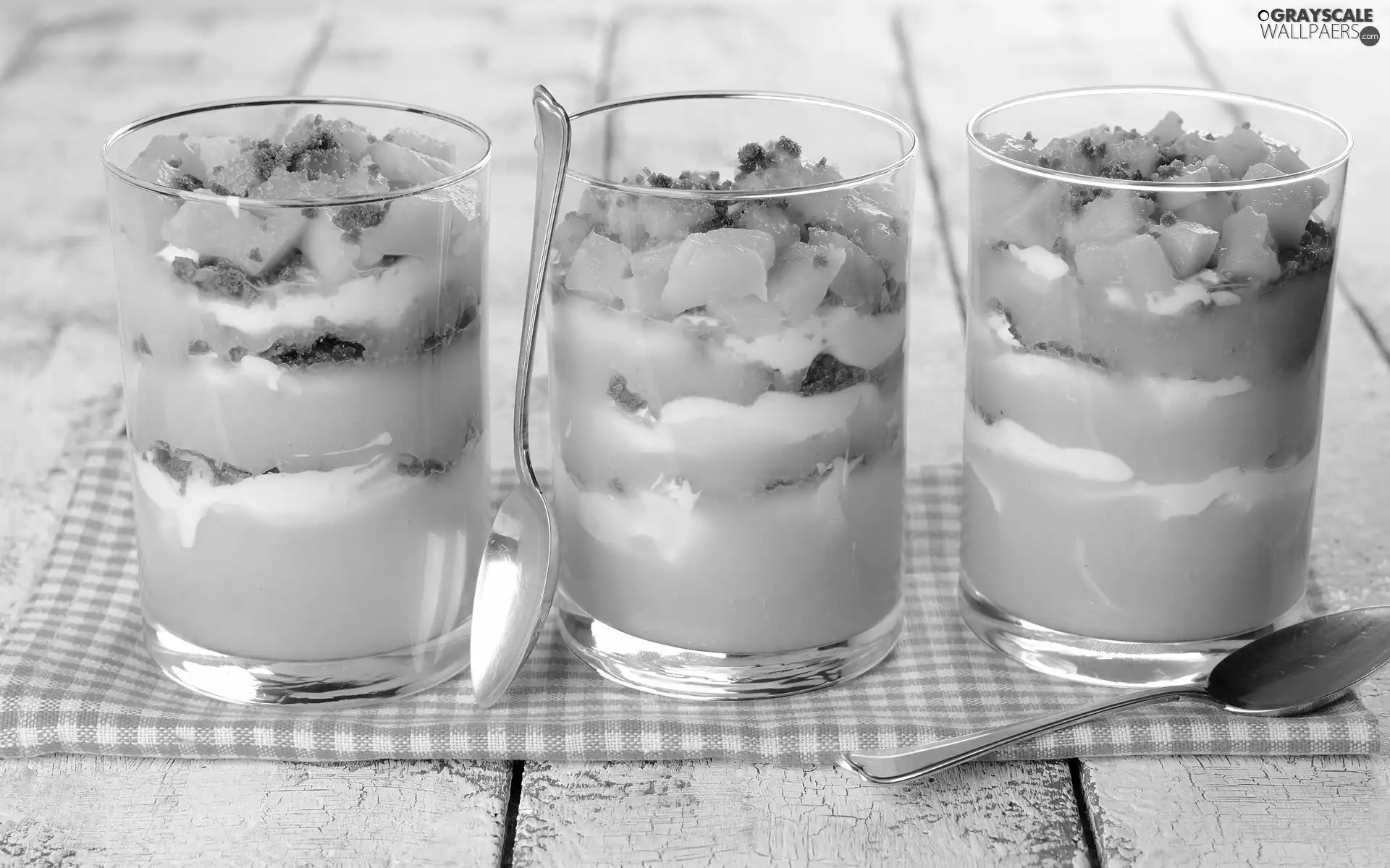 Spoons, desserts, fruit