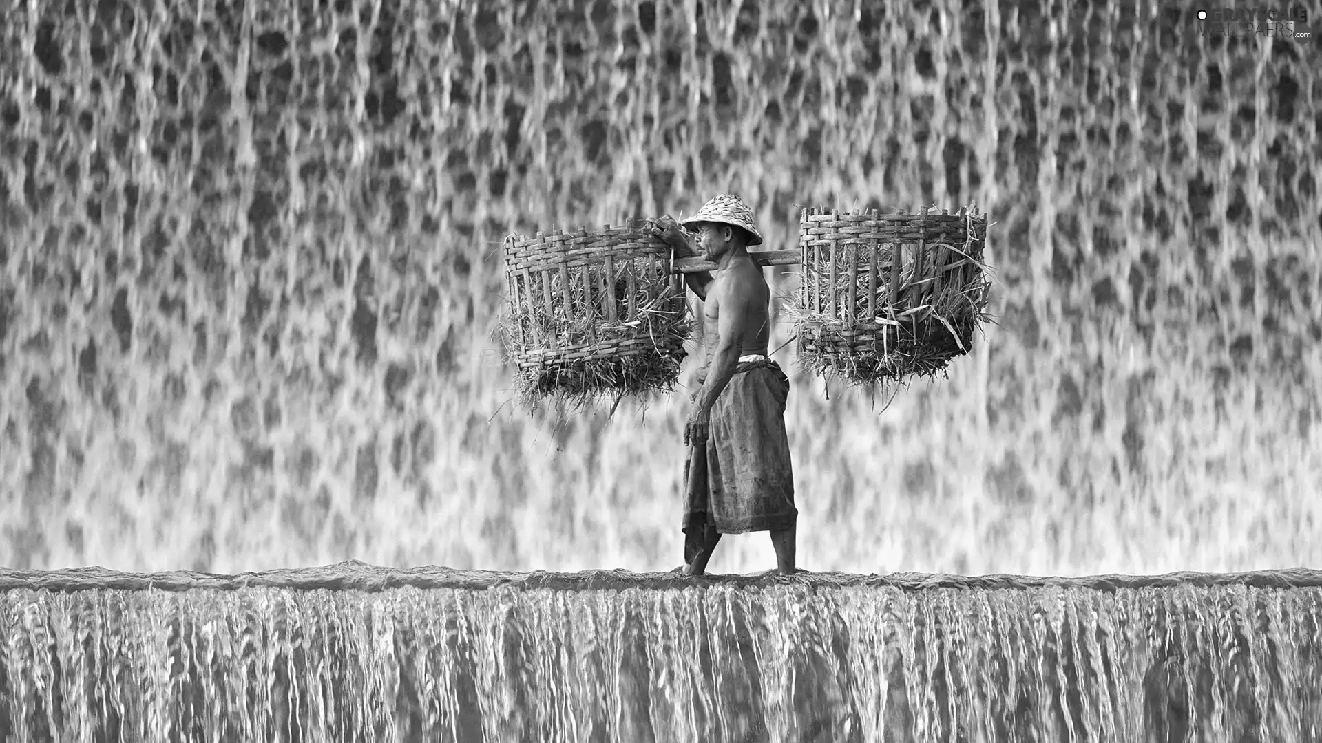 Baskets, a man, waterfall