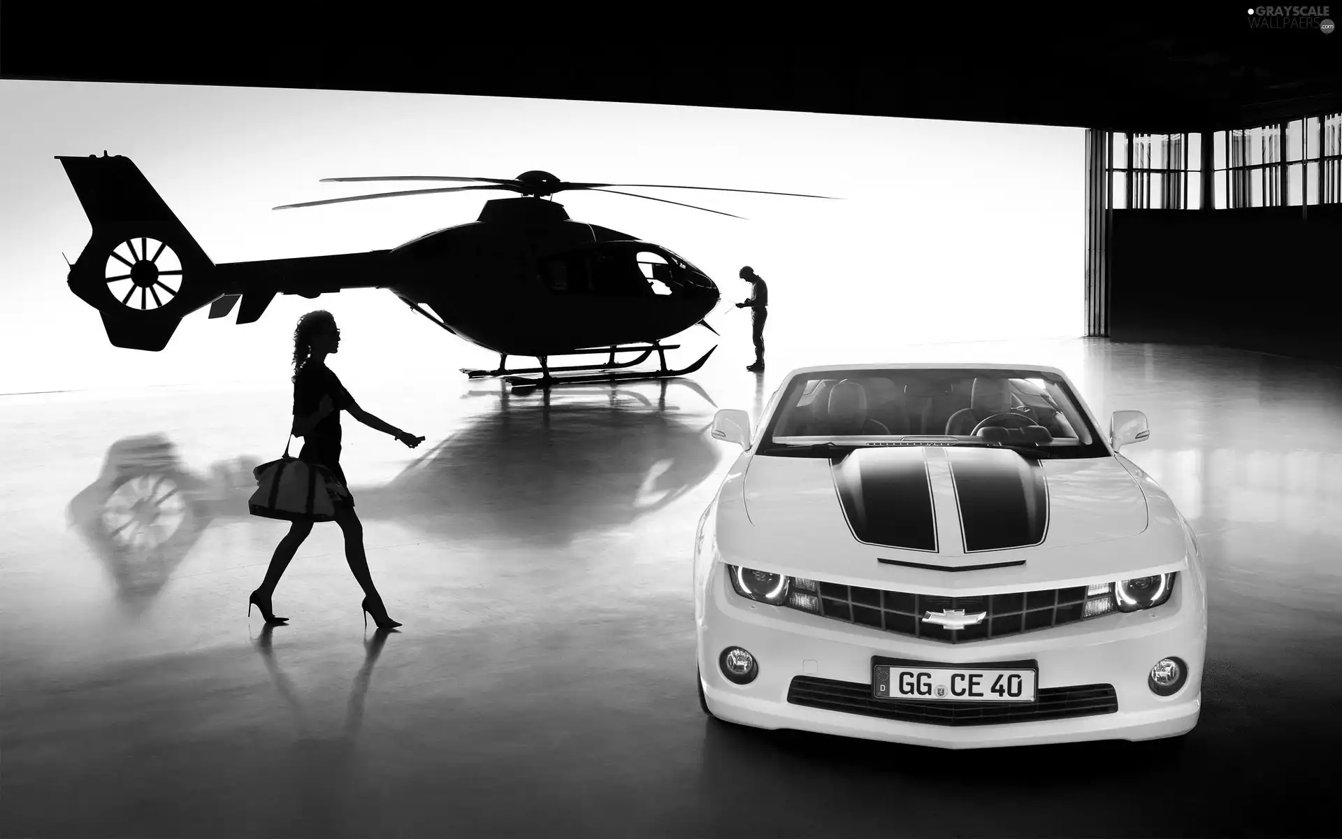 Women, a man, Camaro, Helicopter, Chevrolet